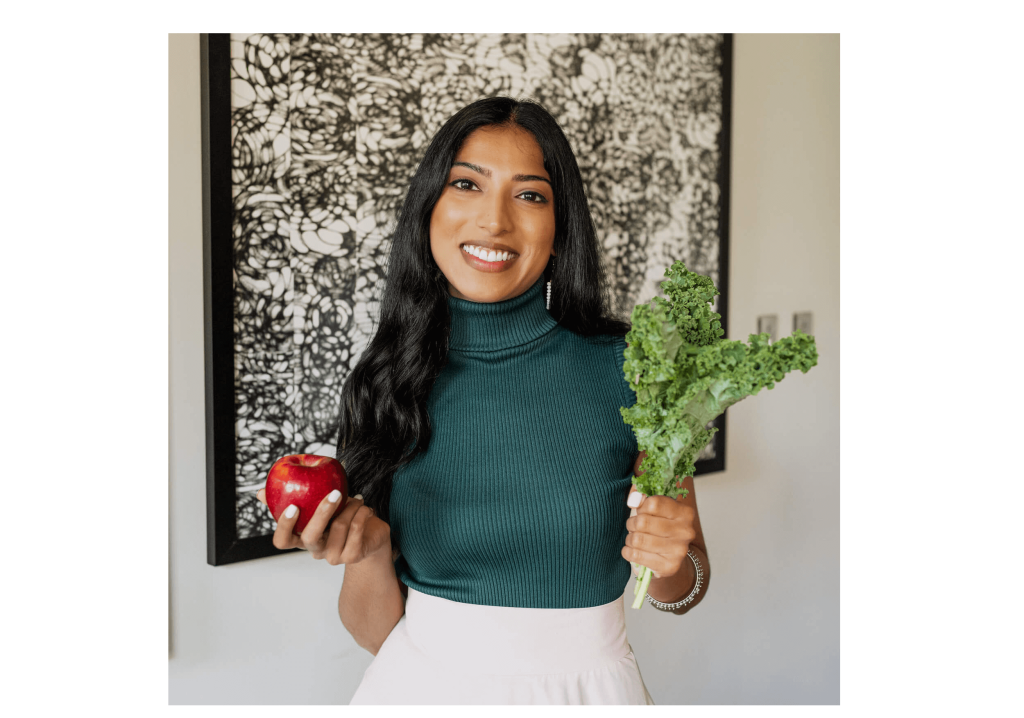 plant based vegan telemedicine doctor Christina Cherian holding apple and kale tiny 1 1024x718